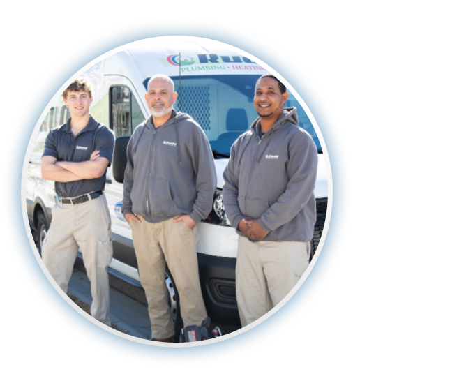 Three technicians posing in front of van